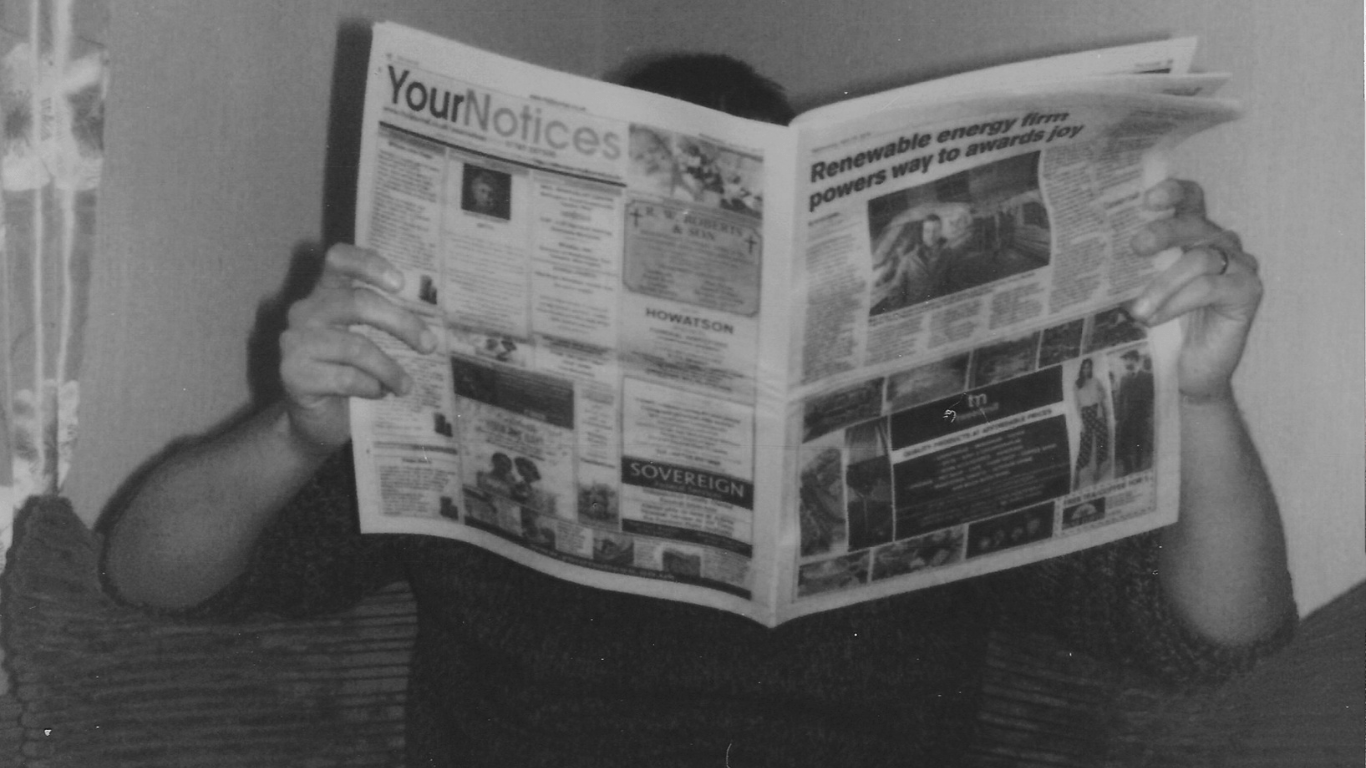 reading a newspaper